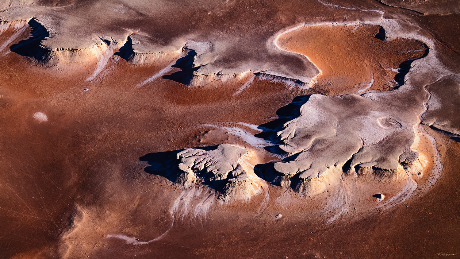 Animal tracks in the desert neat salted cliffs in the namibian desert as seen from the air