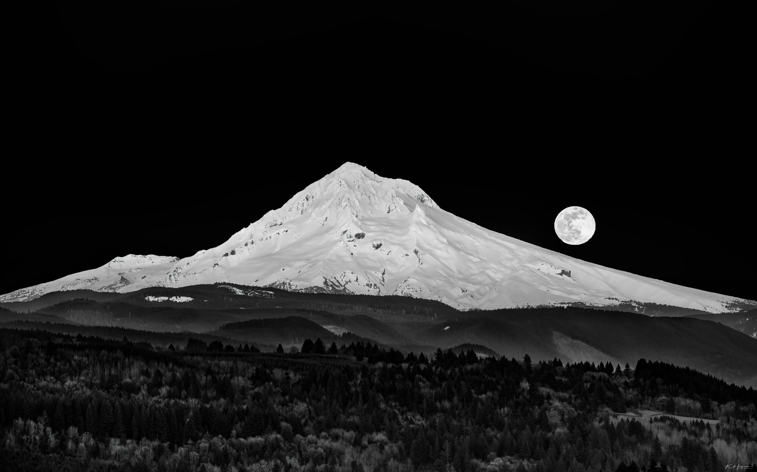 super moon lighting up Mt Hood and a valley with trees and clearcuts in sandy oregon 